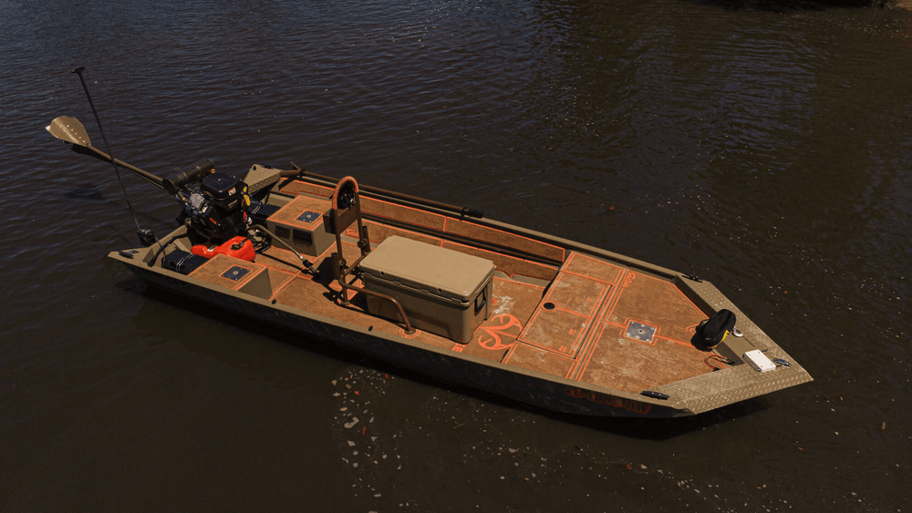 Camouflage-pattern flooring on a low-profile fishing boat with a bow deck, storage box and trolling motor